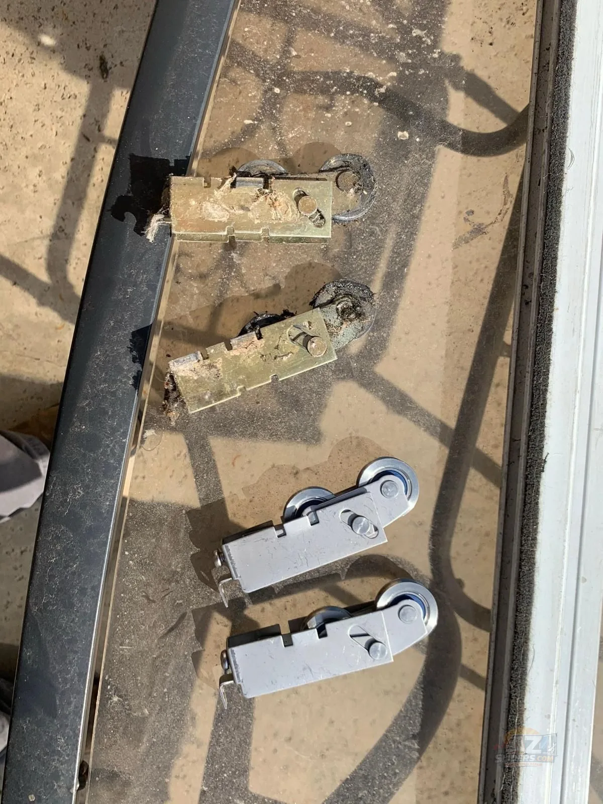 Corroded worn sliding door rollers replaced with new heavy duty rollers — Phoenix AZ by AZSliders
